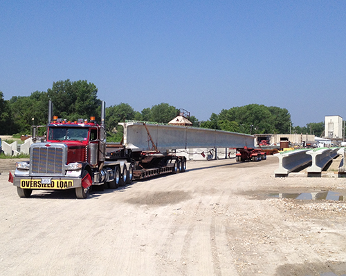 Truck transporting bridge beam.png